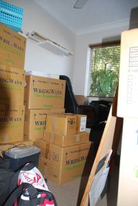 Somewhere among those boxes is my desk!
