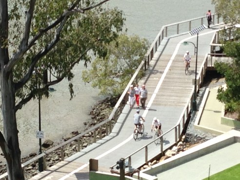 Boardwalk riders alongside the Brisbane River, Australia.