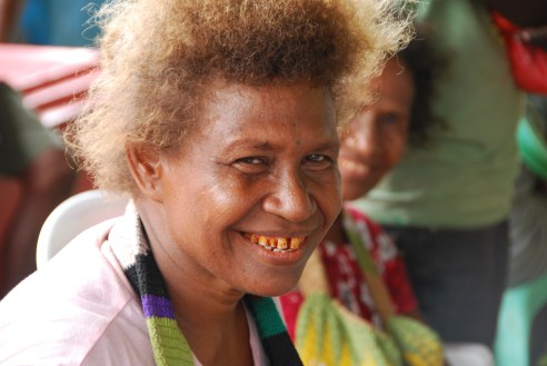 A betel-nut smile from a woman selling fish at the Honiara Central Market.